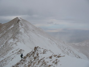 The author bucks the wind near a summit at 13,000ft. But was this the place with the highest wind velocity that day? Surprisingly, no.